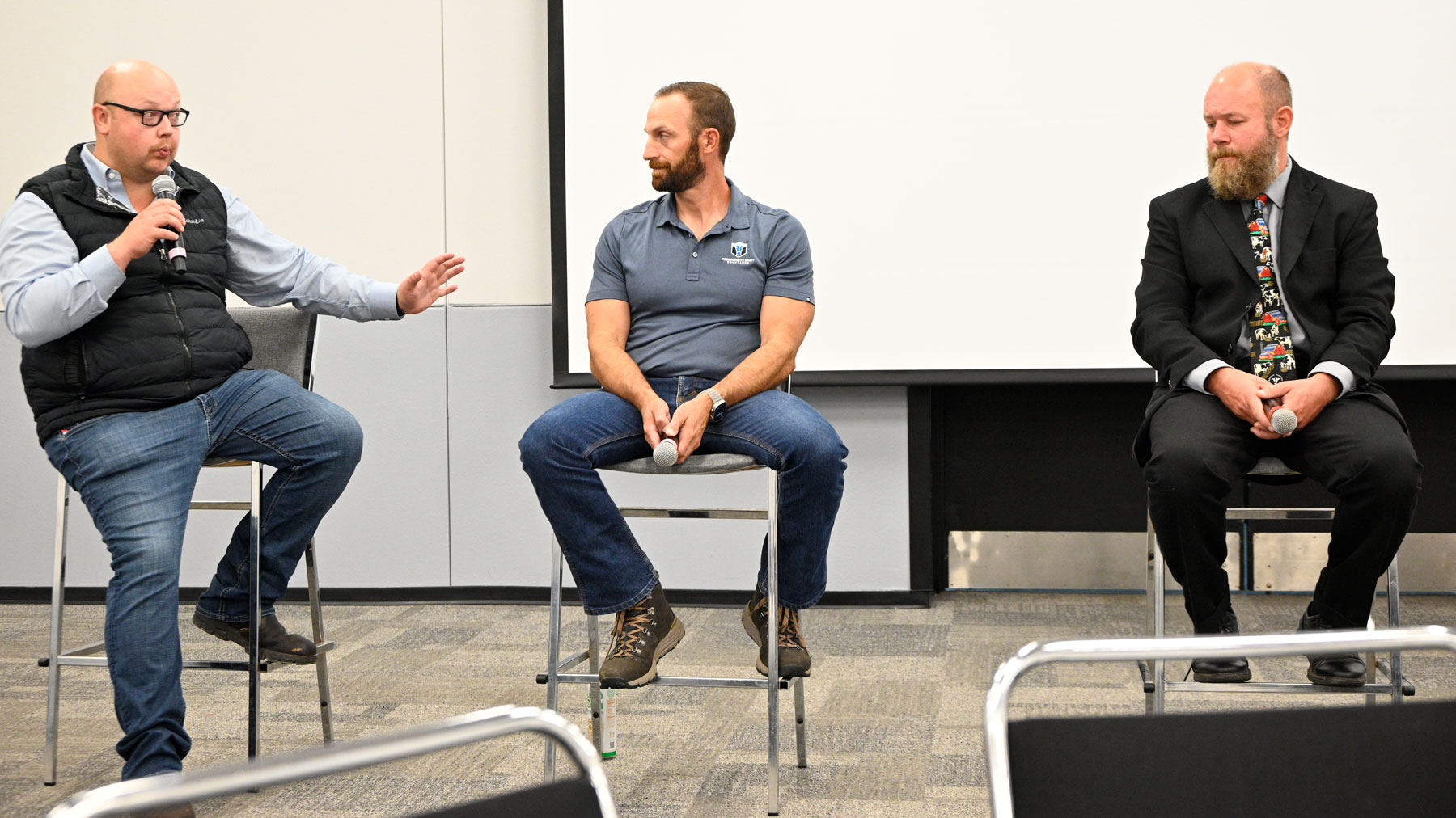 Chris Torres - Jordan Siemers (left) speaks as part of a World Dairy Expo panel with John Goeser (center) and Nate Zwald