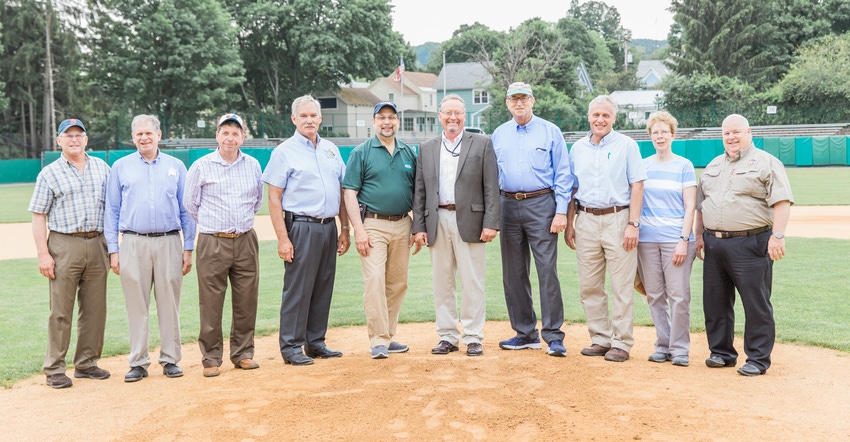 Richard Ball, commissioner of agriculture in New York, center, was elected in September to lead the National Association of S