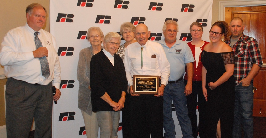 Stewart Ramsey stands with the William Walther family, the New Castle County Farm Bureau’s Farm Family of the Year