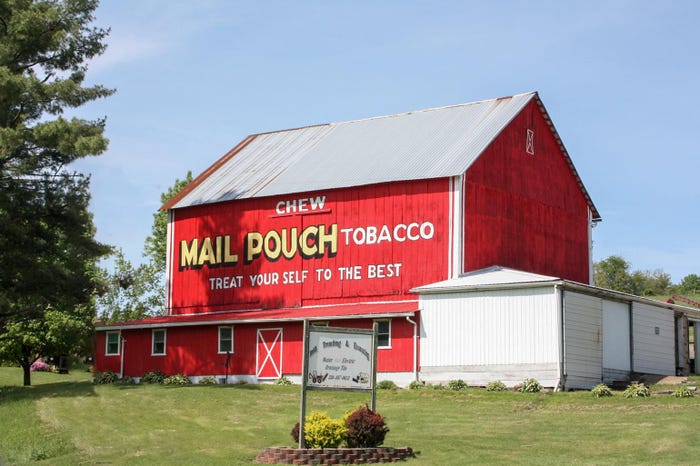 Mail Pouch Tobacco advertising on the side of a red barn