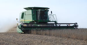 combine in soybean field