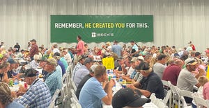 people eating in a Beck’s seed warehouse during a field day