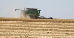 Combine in wheat field