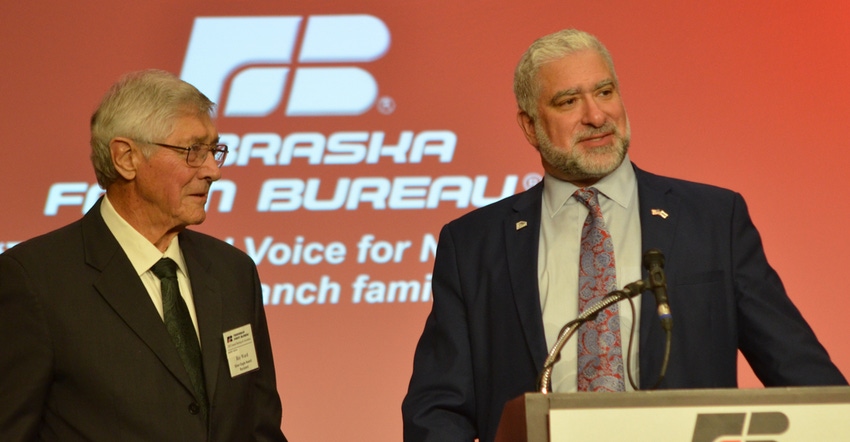 Ray Ward receiving the Nebraska Farm Bureau Silver Eagle Award from organization president Mark McHargue 