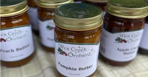 A close up of Wea Creek Orchard's jars filled with pumpkin butter