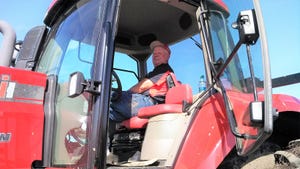 Roger Luebbe in cab of tractor