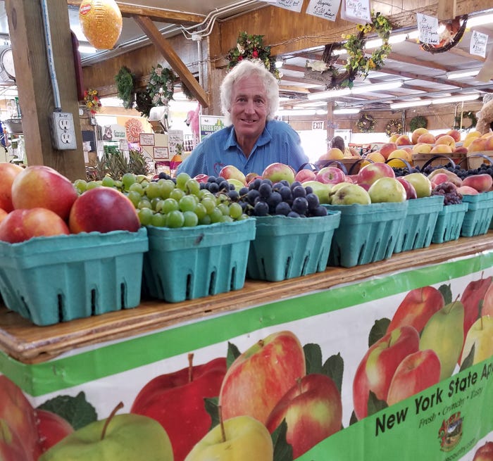 Dennis Ouellette shown with fresh produce at Ontario Orchards' store in Oswego, N.Y.