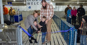 Defenbaugh family cuts ribbon for hog barn