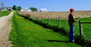 farmers gazes over fields