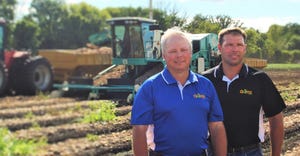 Brothers Richard and Roderick Gumz stand in a field at Gumz Muck Farms 
