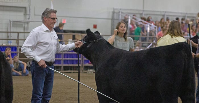  North Dakota Governor Doug Burgum, partnered with Anna Peterson of Bowbells, N.D. participates and showcases in the beef division. 