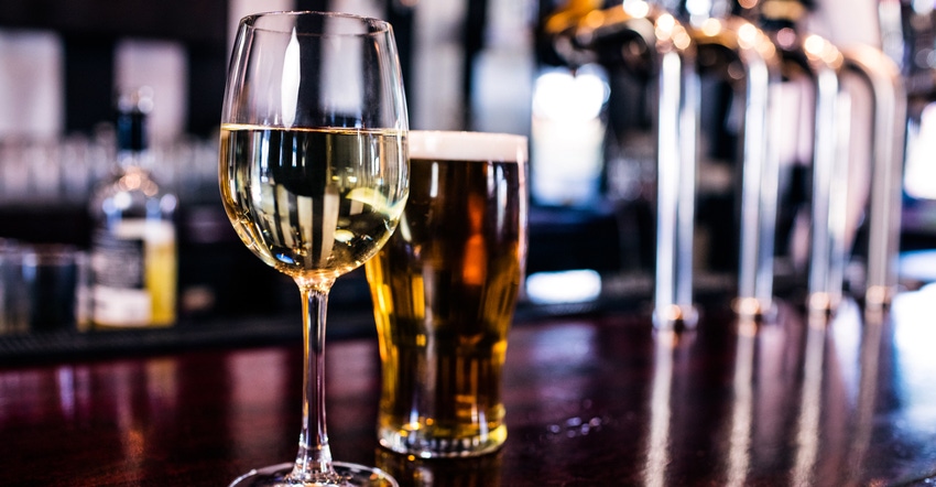 wine glass and beer on bar wine glass and beer on bar