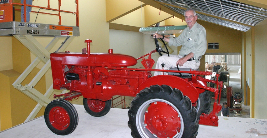 Jim Beaty ‘drives’ this restored Farmall tractor