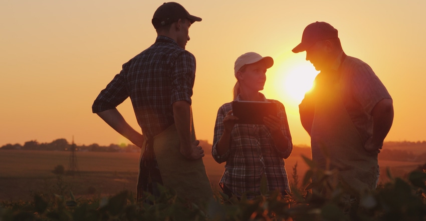 Group of farmers talking in field Group of farmers talking in field