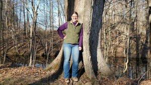 Amanda Kautz standing in front of a tree