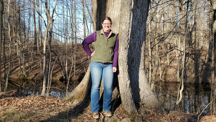 Amanda Kautz standing in front of a tree