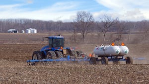 Tractor applying anhydrous ammonia fertilizer