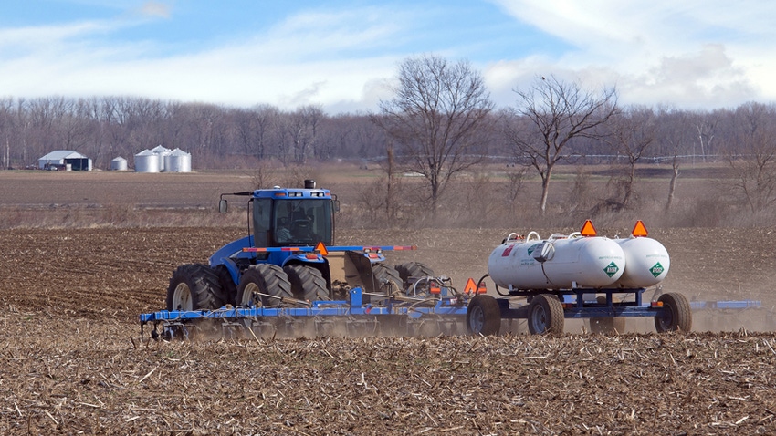 Tractor applying anhydrous ammonia fertilizer