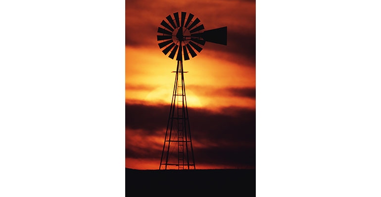 Sunset behind windmill