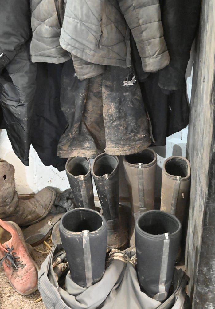 Coats and boots on rack