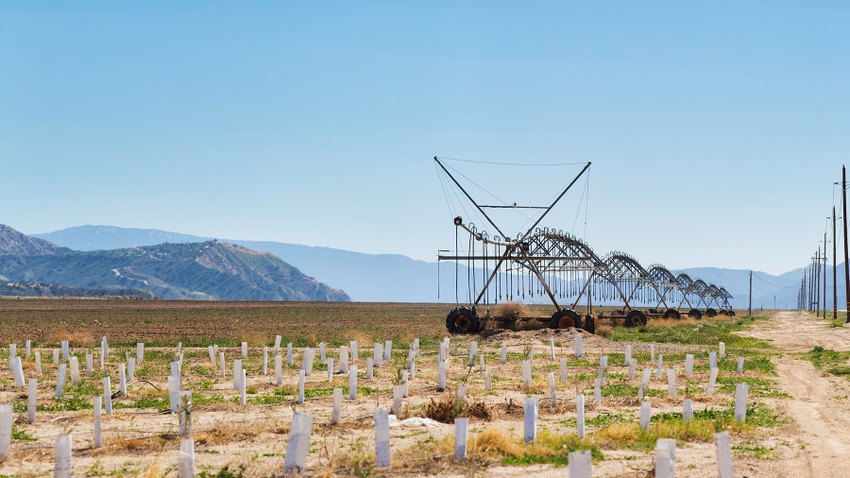 Agricultural wheeled irrigation sprinkling system in California Desert