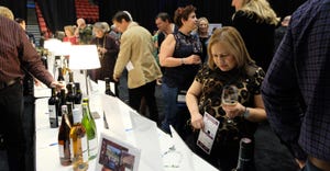 guests looking at silent auction items at the Wine Industry Foundation Party and Auction