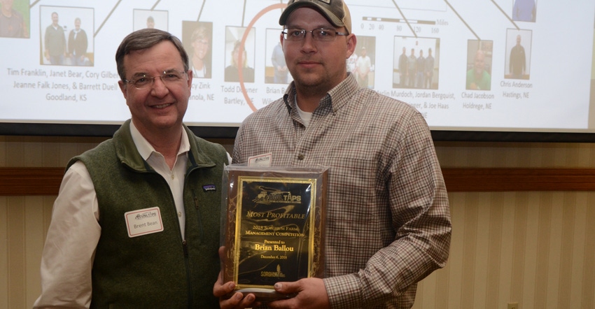 Brent Bean, director of agronomy at the U.S. Sorghum Checkoff, hands the award for most profitable in the sorghum competition