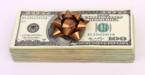 a stack of money with a bow on it