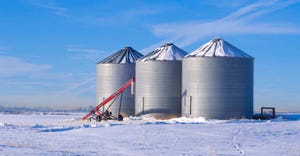 three grain bins in the winter