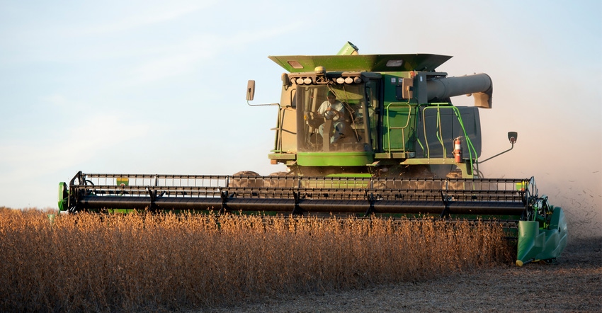 Tractor harvesting soybeans