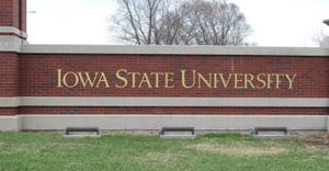 iowa state university gold sign on brick wall