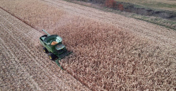 combine going through a field