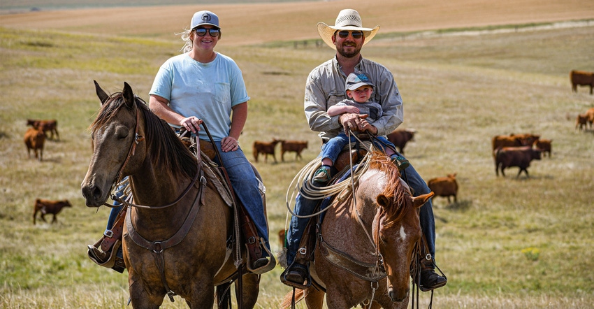 Haley, Max and young Max Robison on horses with cattle in background Haley, Max and young Max Robison on horses with cattle in background