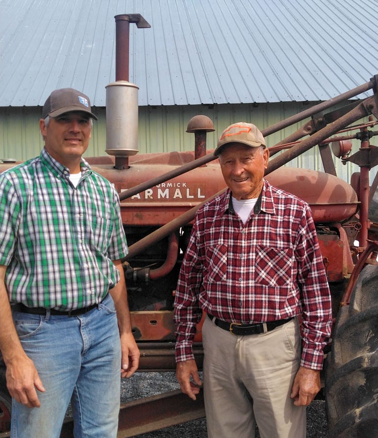 Mike Knauer and his father Frank with their 1947 Farmall M tractor