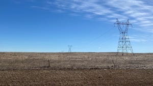 power line towers across a field