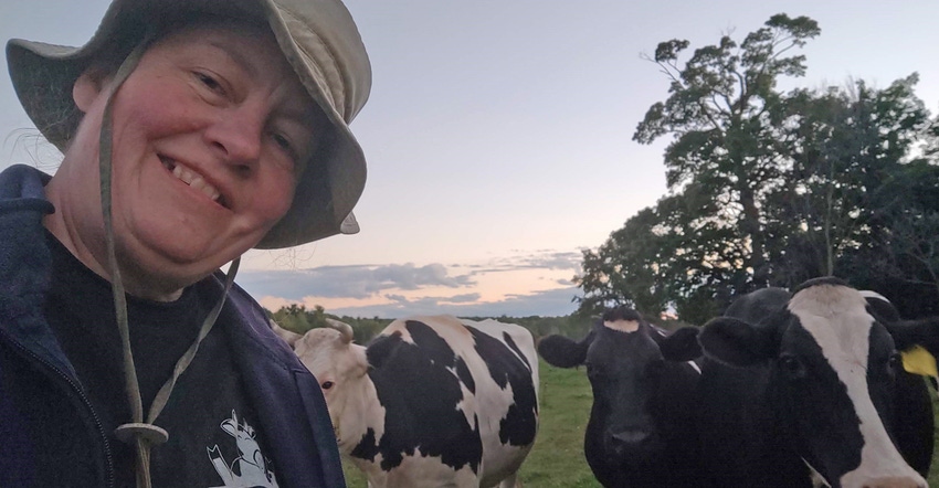 Doris Mold selfie with Holstein dairy cows