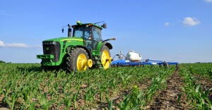 John Deere tractor making sidedress application in corn
