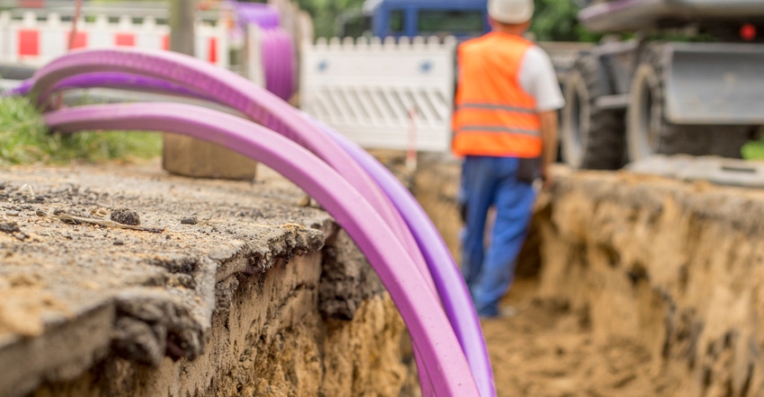 fiber optic high being installed in ground for high-speed internet