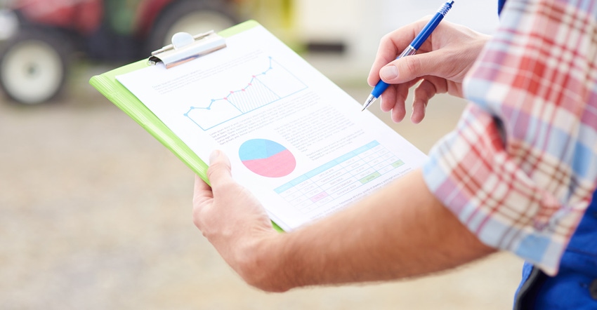 Farmer with data analysis clipboard