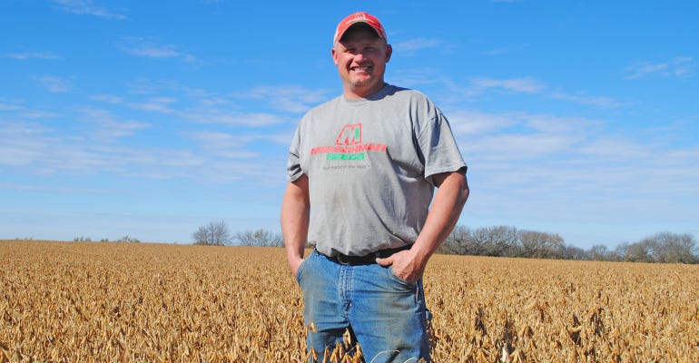 Dodge County farmer, Chad Christianson standing in field