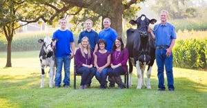 Hendrickson family with two cows