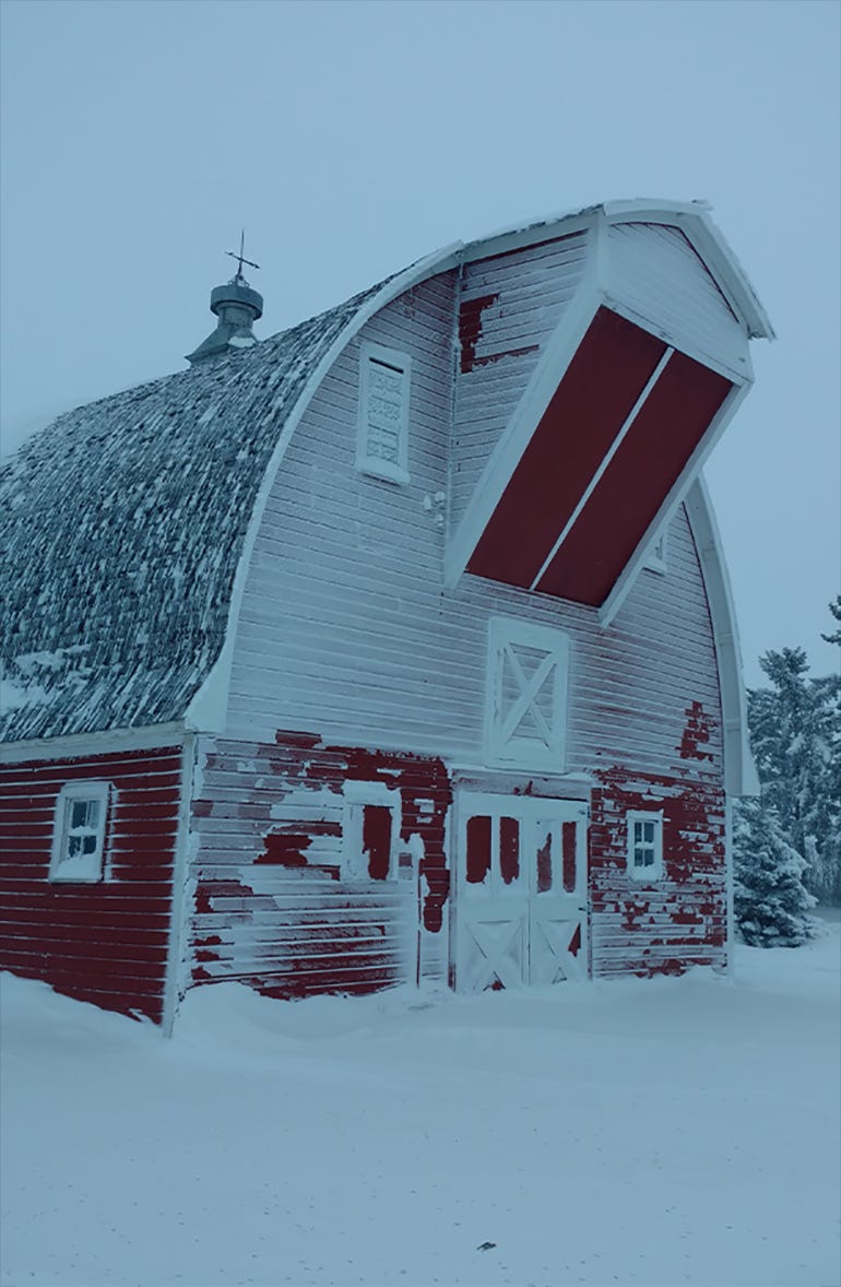 1930s barn after snowstorm