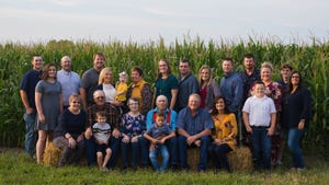 Hugh Moore Jr. family poses in front of a cornfield