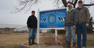 Gregg and Doug and Gregg’s son Alex Ode standing next to Royalwood Farm sign