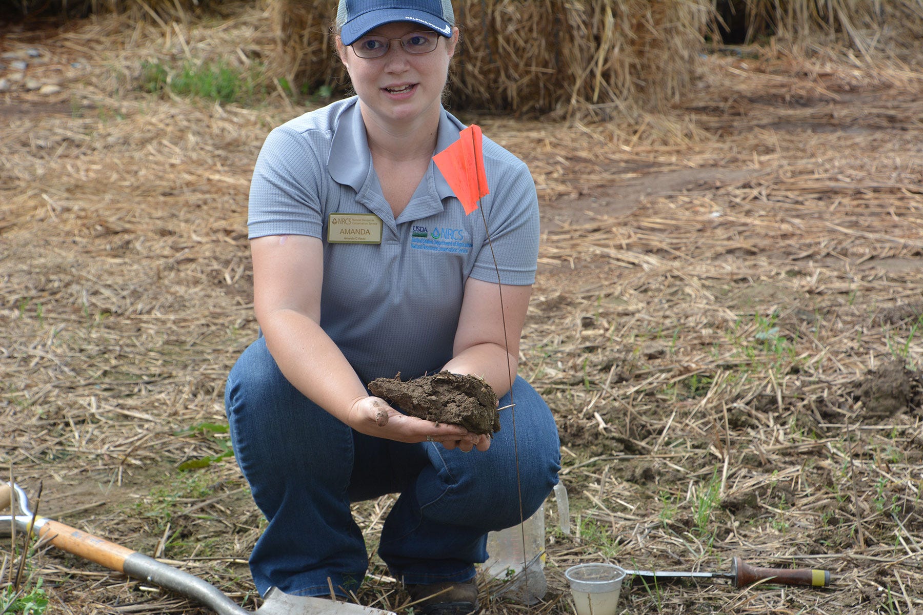 Amanda Kautz holding soil Amanda Kautz holding soil