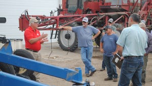 Nebraska Extension engineer, Paul Jasa , visits with farmers about a planter toolbar design at the Jeff and Jolene Steffen farm