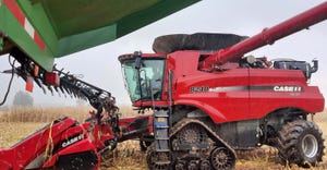 Case combine in the field during rain.
