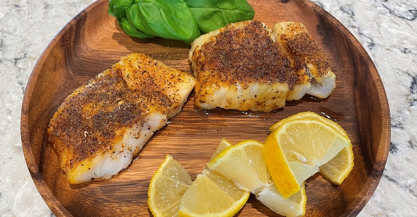 spicy Cajun fish fillets on plate