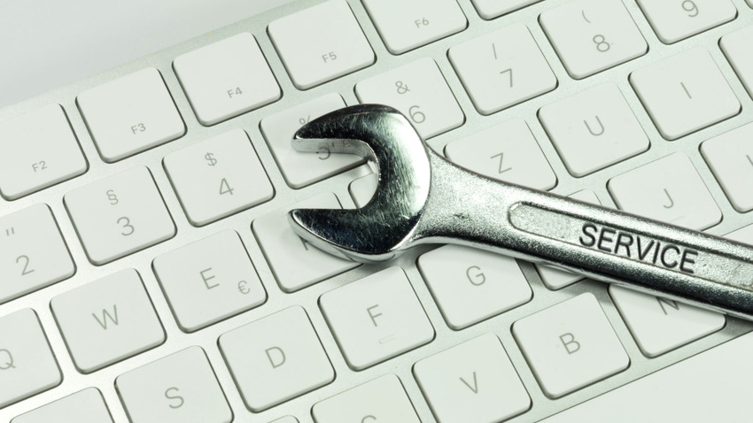 A wrench on a computer keyboard