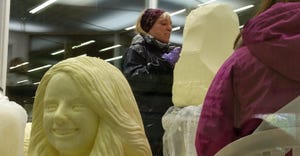 sculptor Linda Christensen carves a contestant of the Princess Kay contest into a block of butter